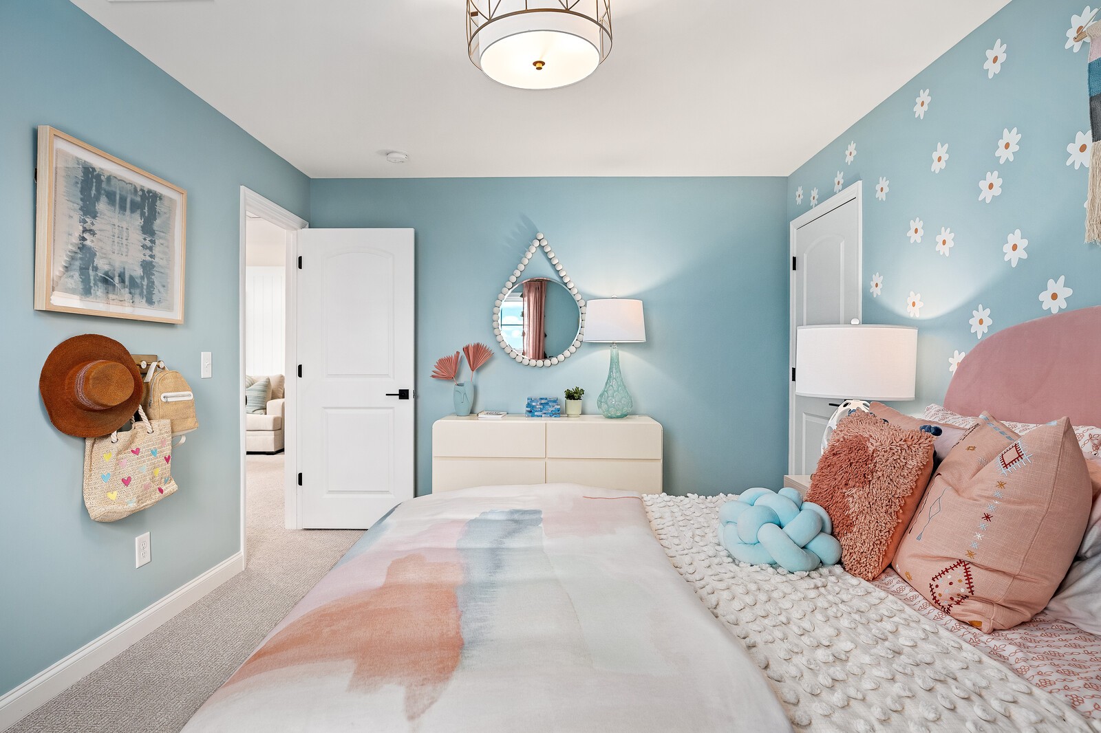 7689 Hatcher Heights Drive Fairview, TN 37062 - Photo 40 of 47 a bedroom with a large bed and a chandelier