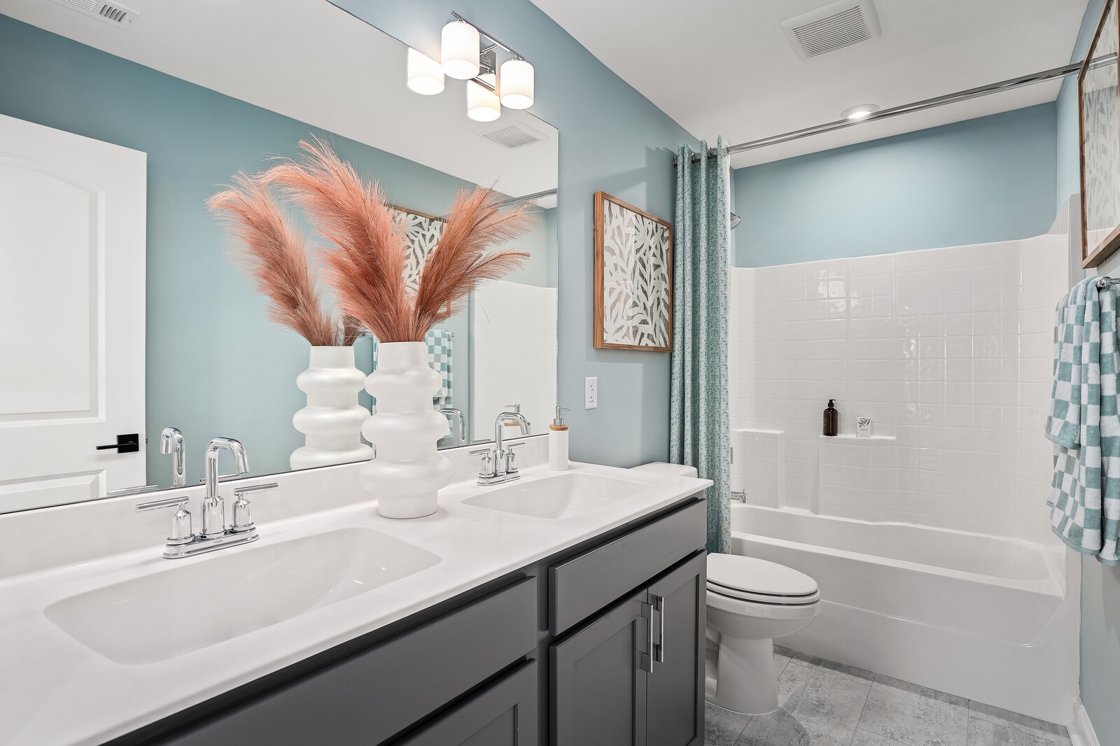 7689 Hatcher Heights Drive Fairview, TN 37062 - Photo 43 of 47 a bathroom with a granite countertop sink a toilet a mirror a vanity a bathtub and shower