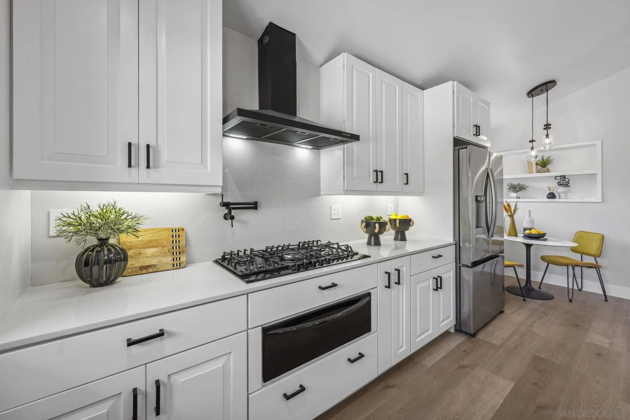 2026 Estero Street Oceanside, CA 92054 - Photo 16 of 72 a kitchen with stainless steel appliances granite countertop a sink a stove and a refrigerator