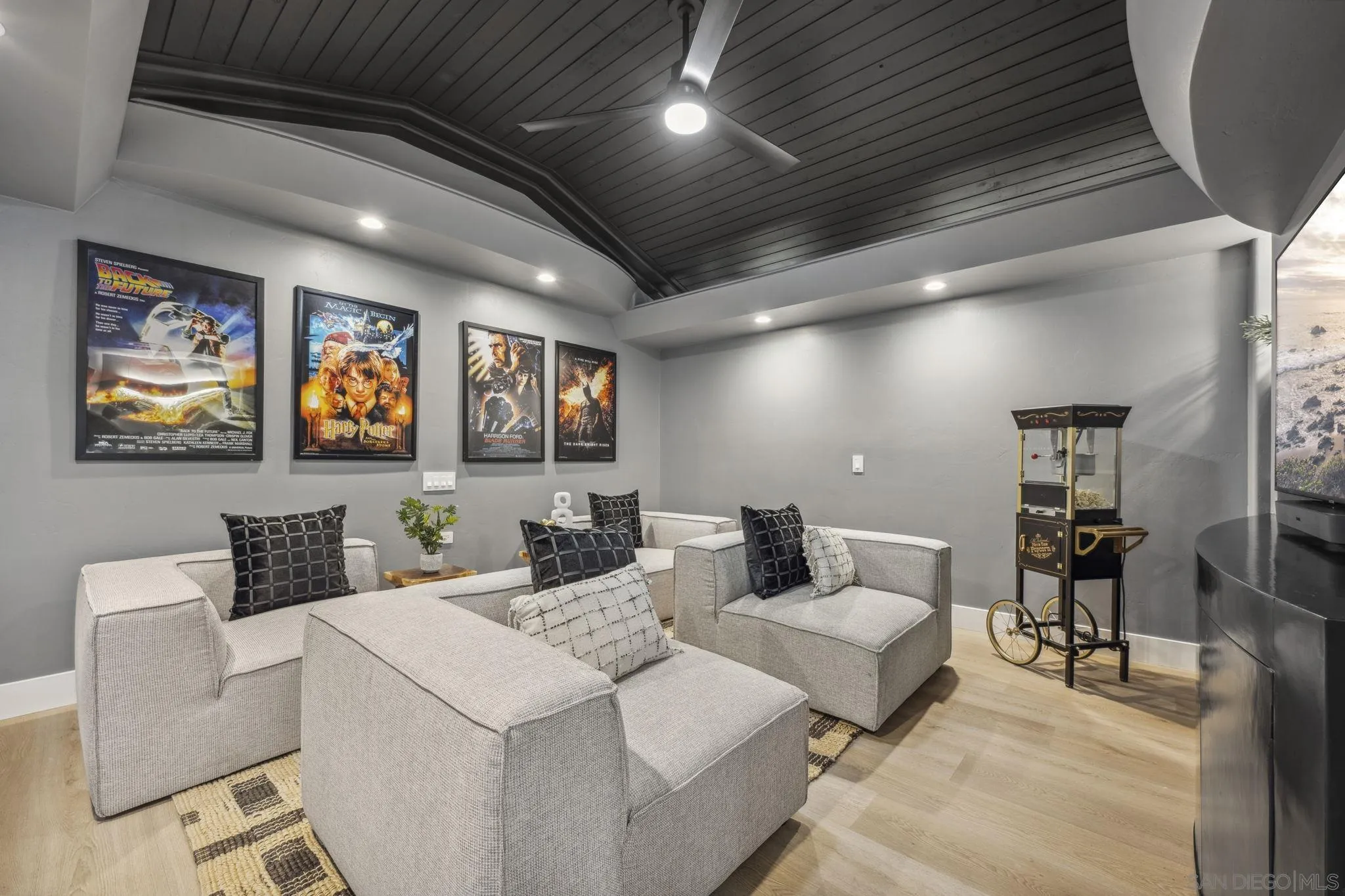 2026 Estero Street Oceanside, CA 92054 - Photo 27 of 72 a living room with large couches and kitchen view with wooden floor