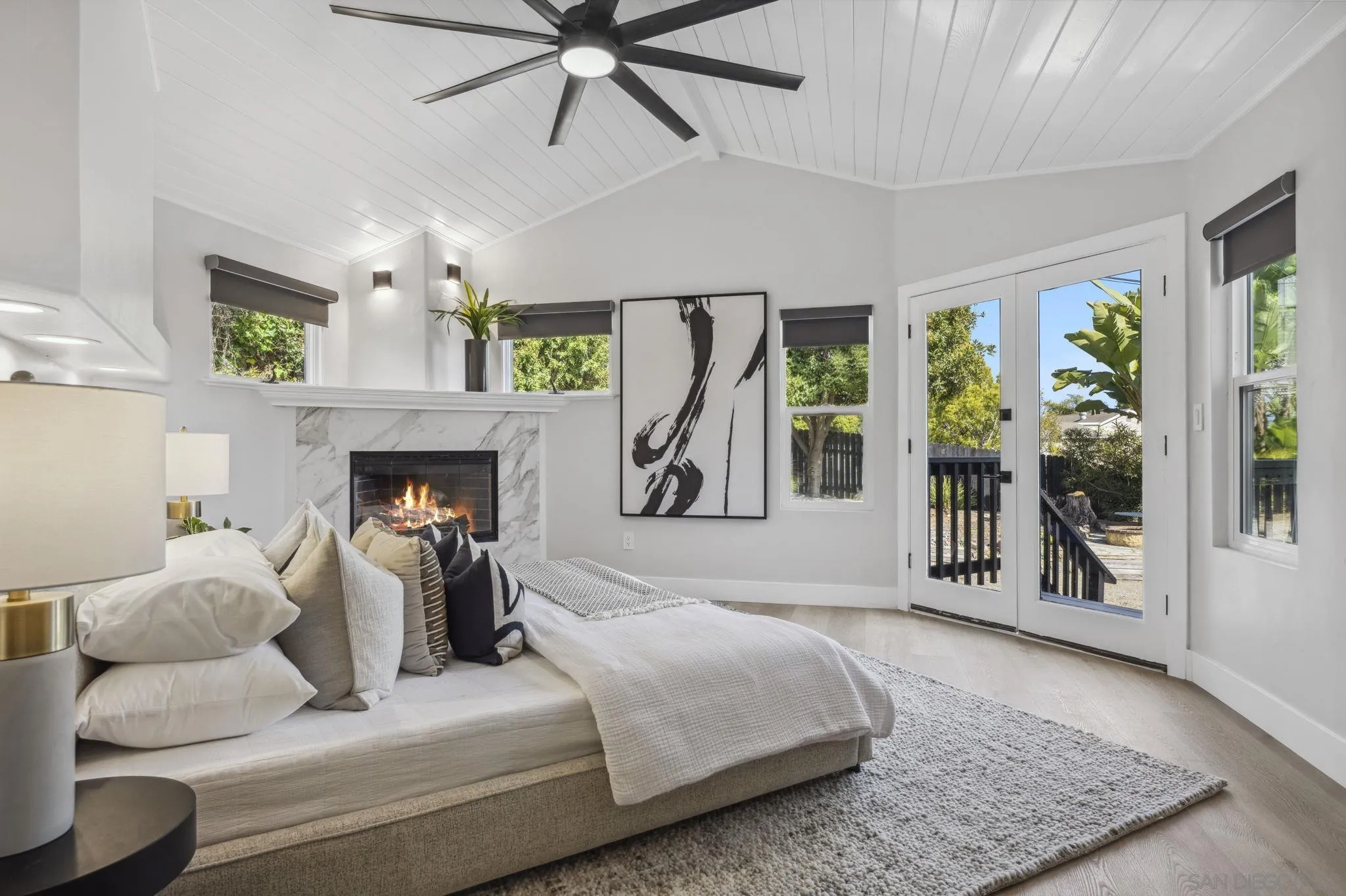 2026 Estero Street Oceanside, CA 92054 - Photo 29 of 72 a bedroom with a bed and glass windows