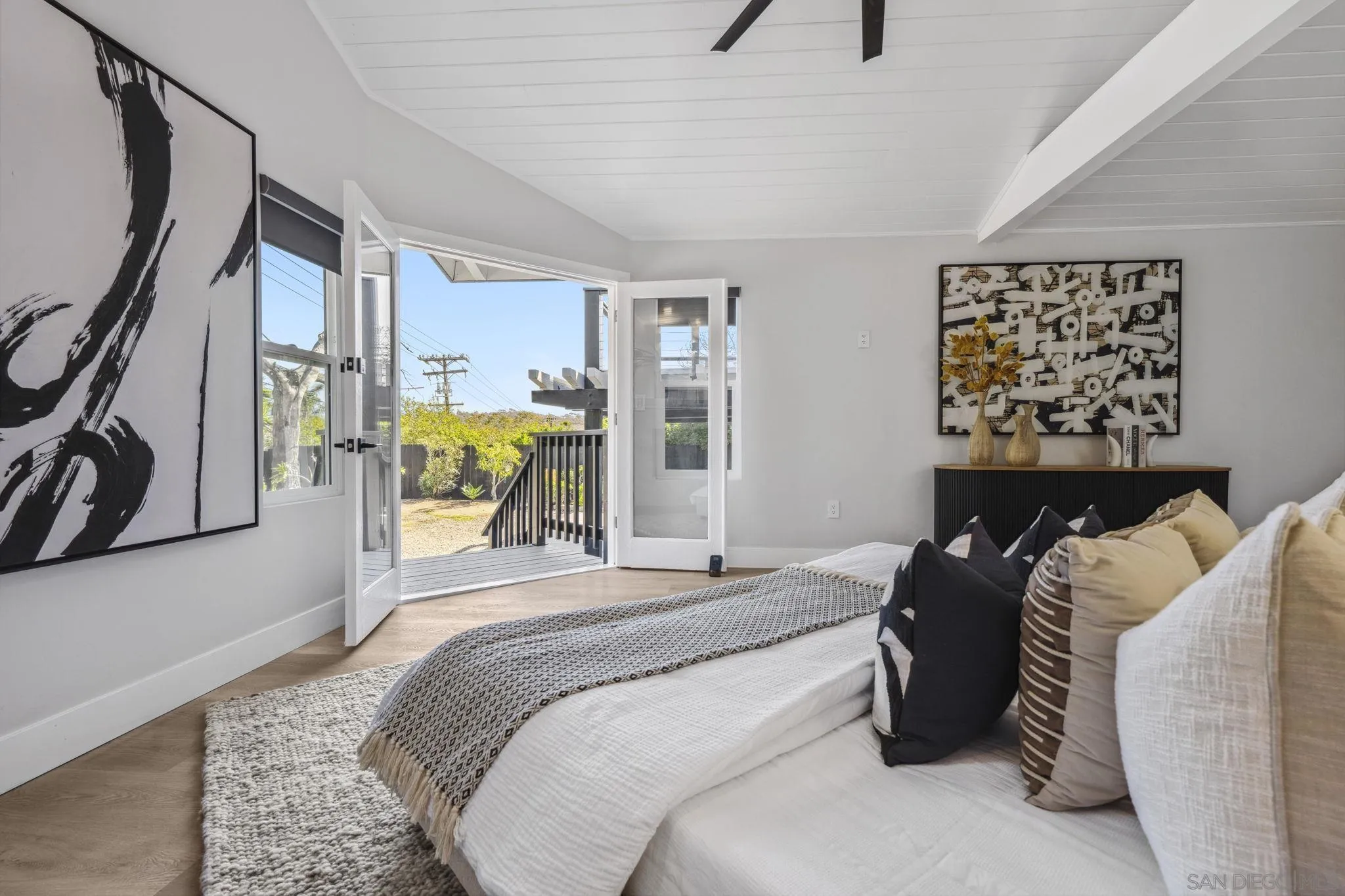 2026 Estero Street Oceanside, CA 92054 - Photo 31 of 72 a bedroom with a bed couch and a window