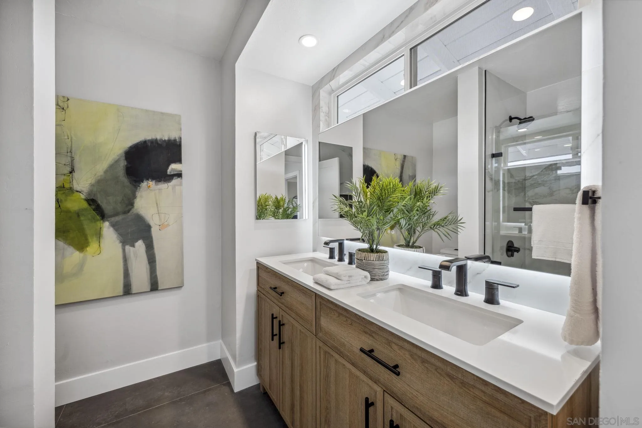 2026 Estero Street Oceanside, CA 92054 - Photo 47 of 72 a bathroom with a double vanity sink and mirror