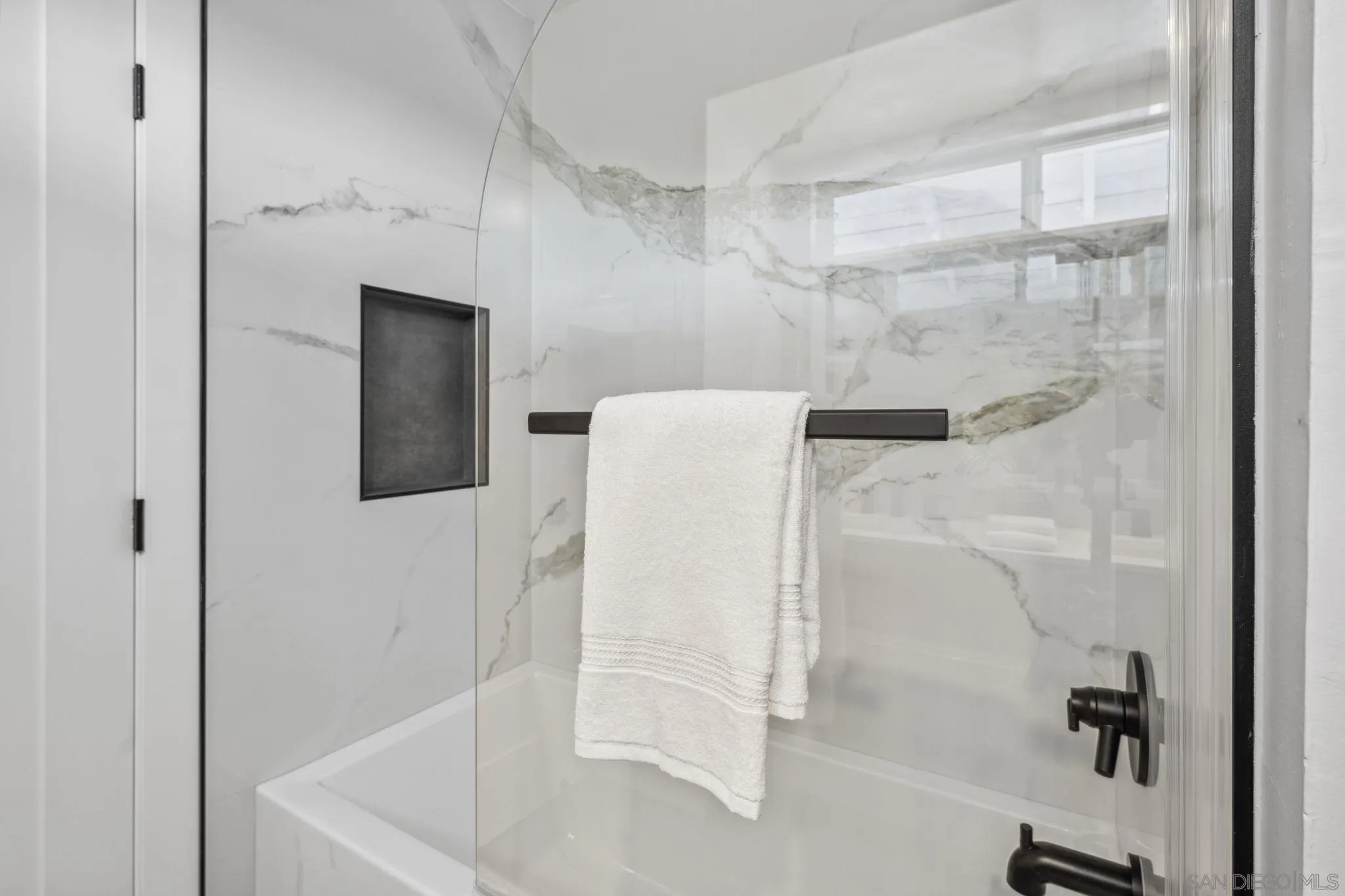 2026 Estero Street Oceanside, CA 92054 - Photo 48 of 72 a bathroom with a bathtub and a shower