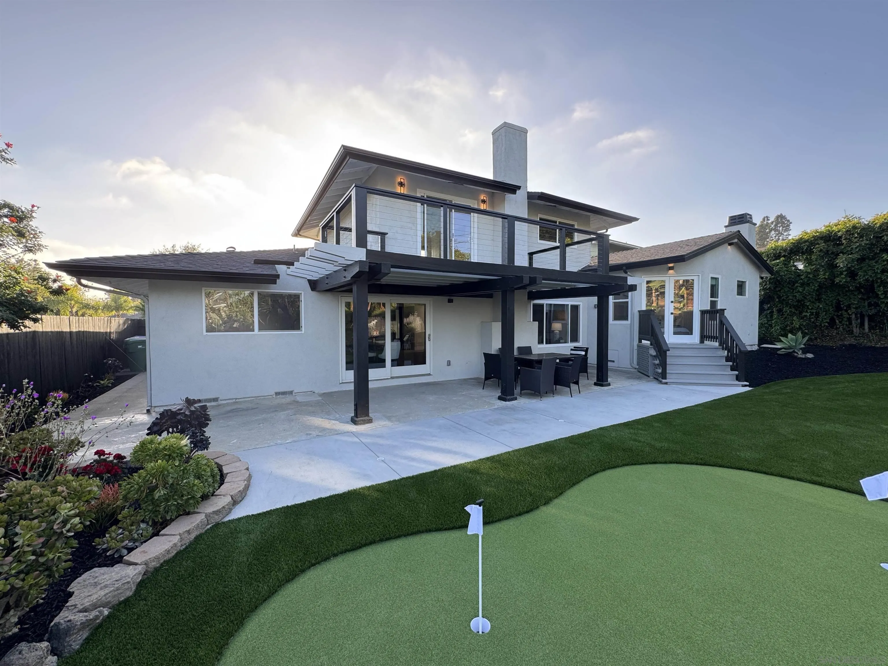 2026 Estero Street Oceanside, CA 92054 - Photo 61 of 72 a front view of a house with a garden and plants