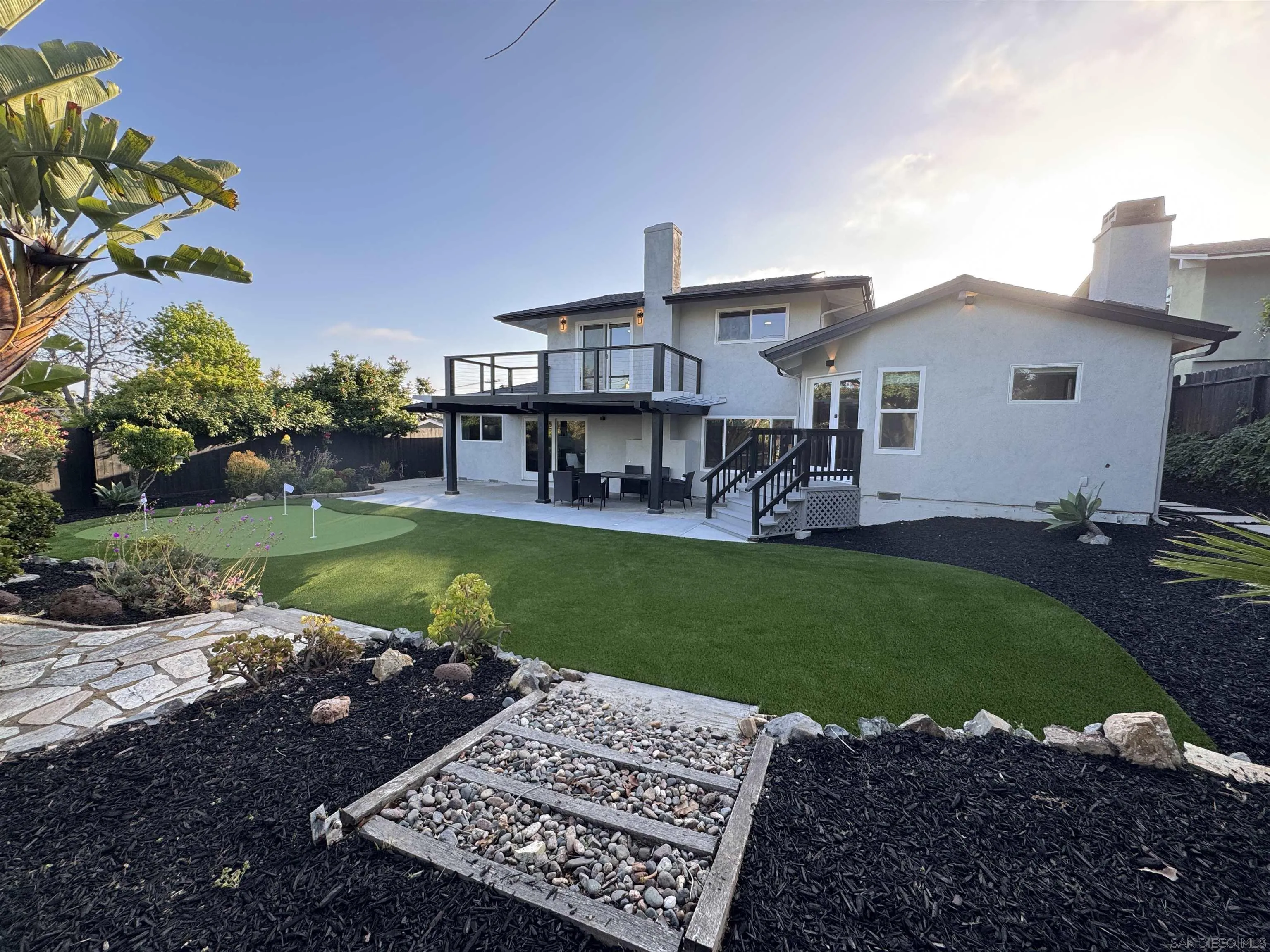 2026 Estero Street Oceanside, CA 92054 - Photo 62 of 72 a view of a house with a yard porch and sitting area