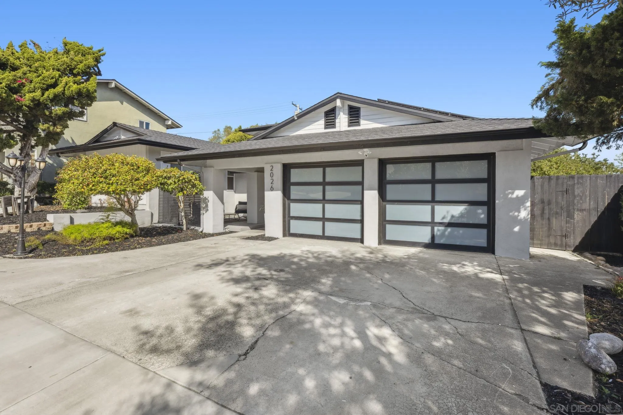 2026 Estero Street Oceanside, CA 92054 - Photo 72 of 72 a front view of a house with a yard and garage
