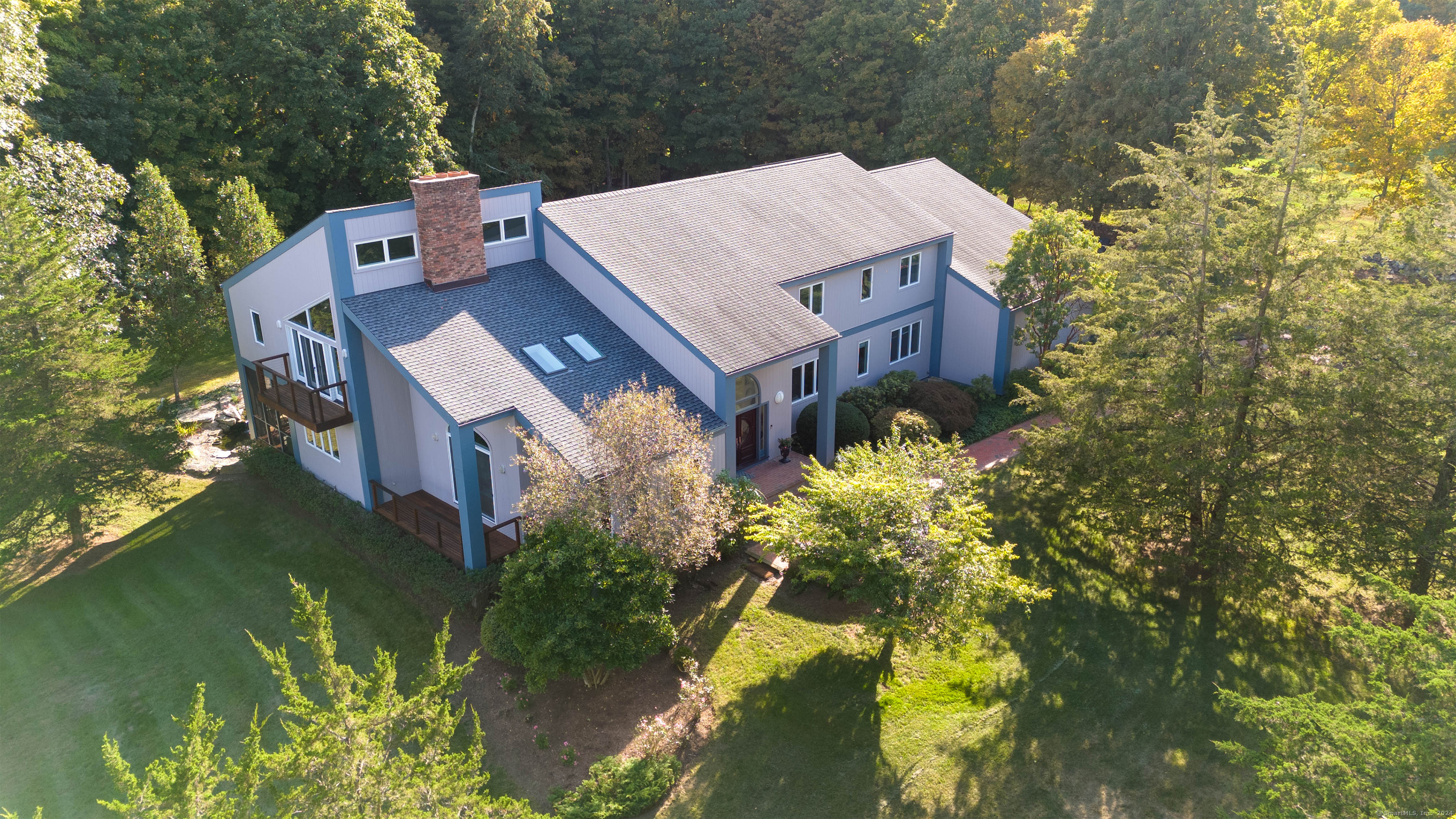 185 Maple Road Easton, CT 06612 - Photo 1 of 1 an aerial view of a house with a yard swimming pool and outdoor seating