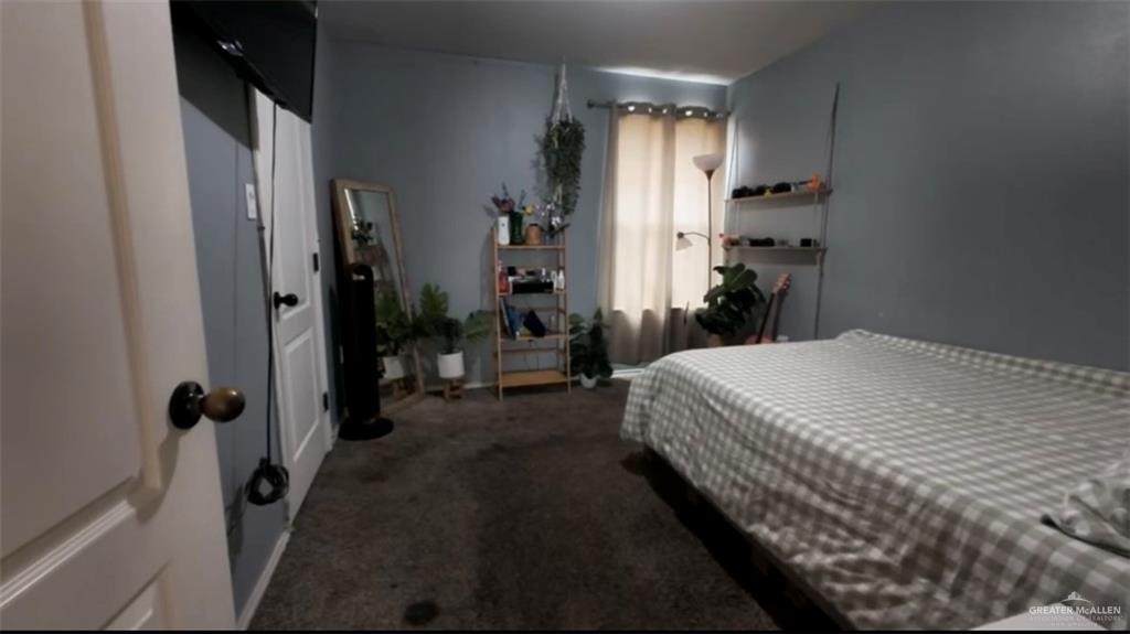 412 Rio Nueces San Juan, TX 78589 - Photo 15 of 19 a bedroom with a bed and a large mirror