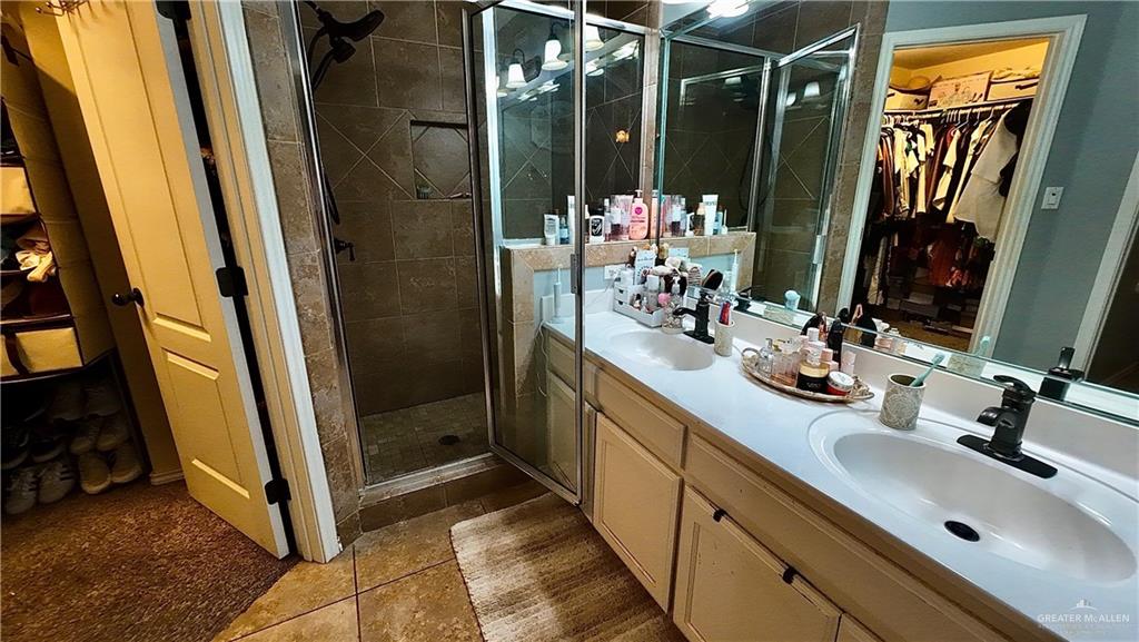 412 Rio Nueces San Juan, TX 78589 - Photo 18 of 19 a bathroom with sink shower and mirror