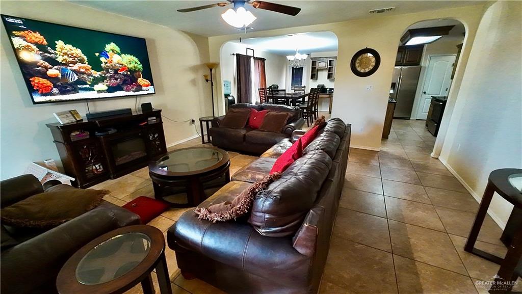 412 Rio Nueces San Juan, TX 78589 - Photo 4 of 19 a living room with furniture and a flat screen tv