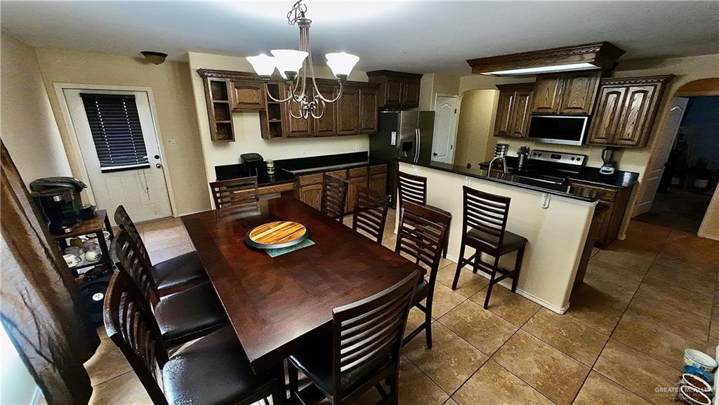 412 Rio Nueces San Juan, TX 78589 - Photo 8 of 19 a view of a dining room with furniture
