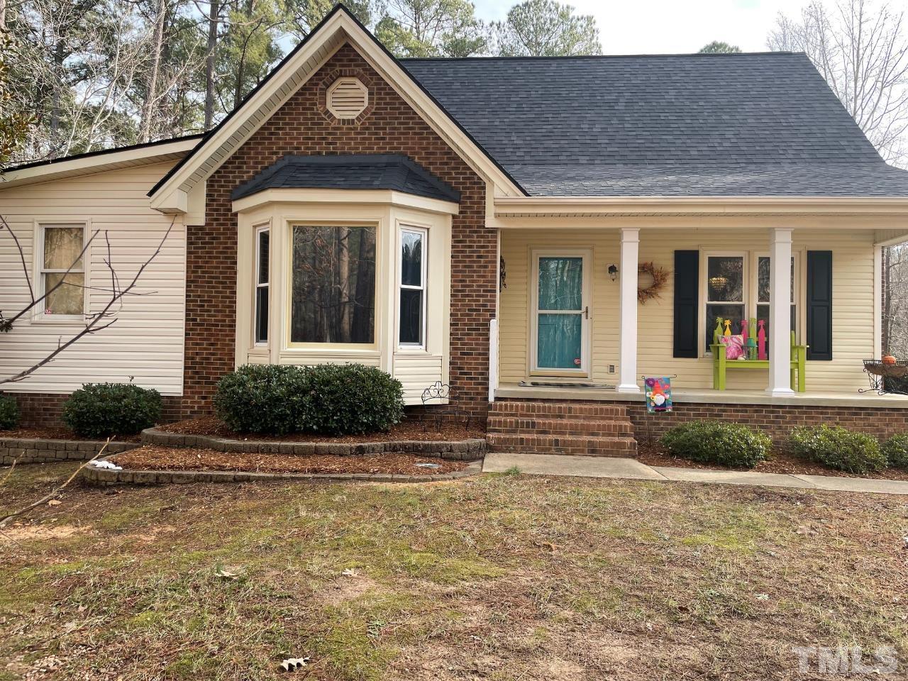 7101 Denlee Road Raleigh, NC 27603 - Photo 1 of 32 front view of a house with a yard