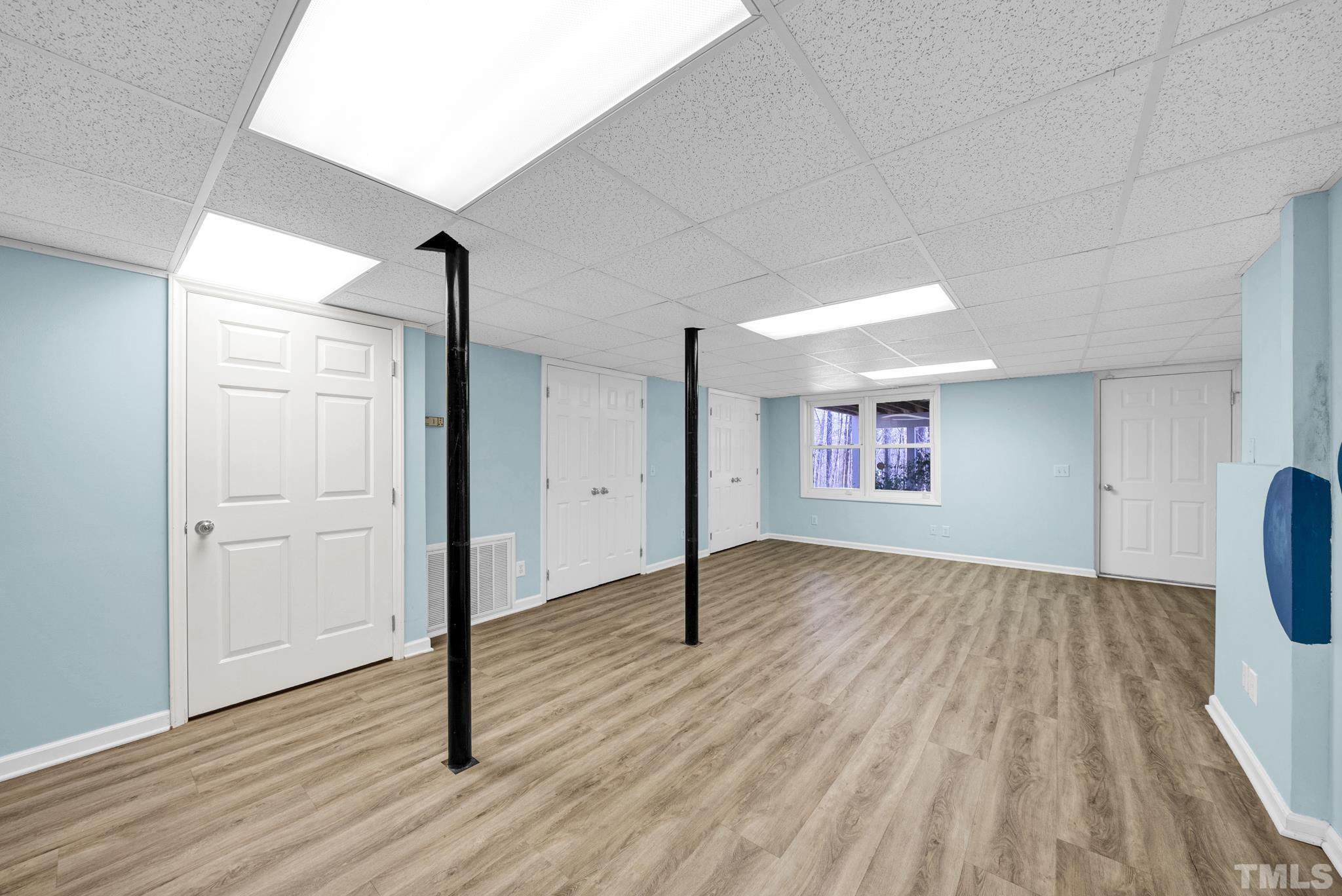 7101 Denlee Road Raleigh, NC 27603 - Photo 21 of 32 a view of empty room with wooden floor