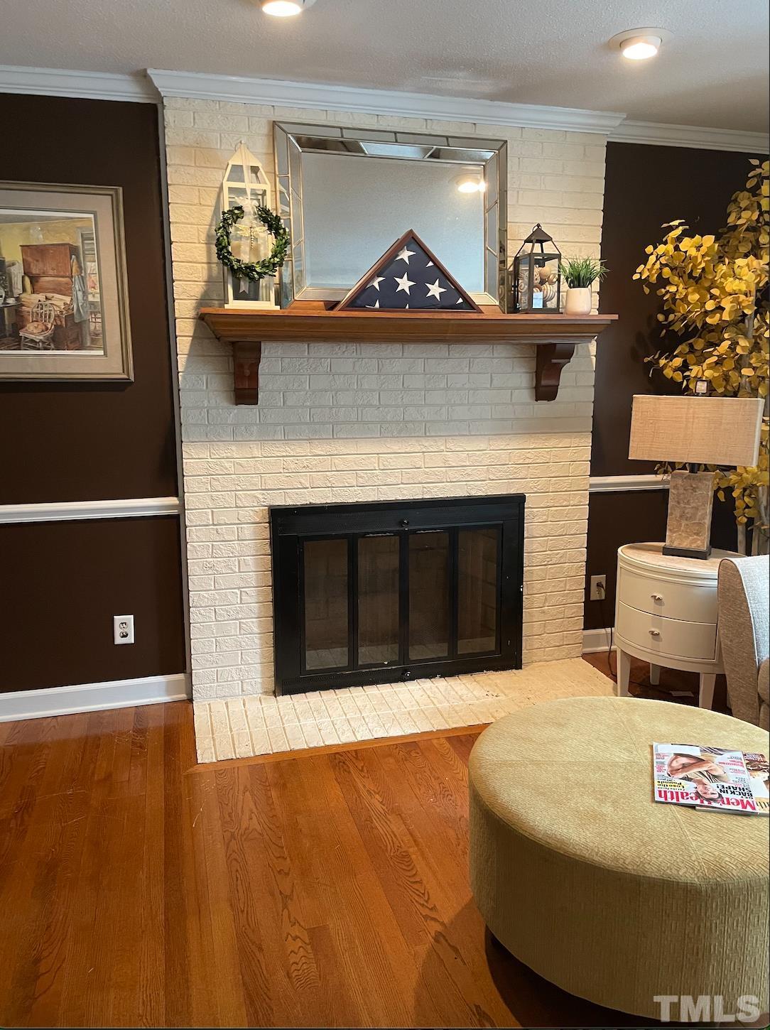 7101 Denlee Road Raleigh, NC 27603 - Photo 7 of 32 a living room with furniture and a fireplace