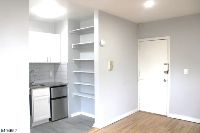a view of storage and utility room with cabinet and cabinet