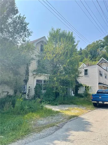 a view of a house with a street