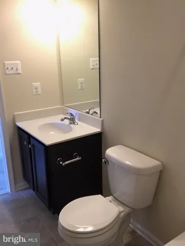 a bathroom with a sink and mirror with shower