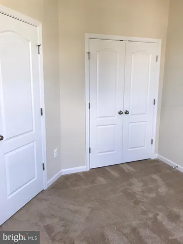 a white toilet sitting in a bathroom