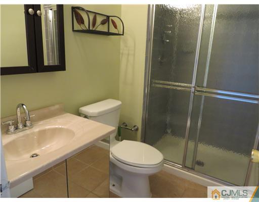36 Gable Court Old Bridge, NJ 07747 - Photo 13 of 22 a bathroom with a sink a toilet and shower