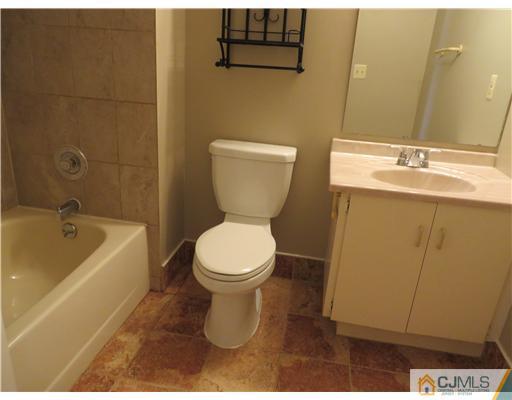 36 Gable Court Old Bridge, NJ 07747 - Photo 15 of 22 a bathroom with a sink a toilet and bathtub