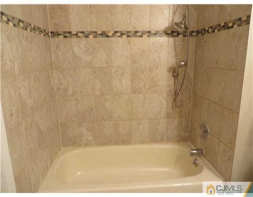 36 Gable Court Old Bridge, NJ 07747 - Photo 16 of 22 a bathroom with a shower and a bath tub