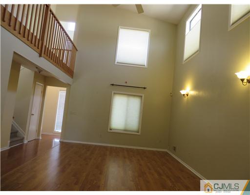 36 Gable Court Old Bridge, NJ 07747 - Photo 18 of 22 a view of an empty room with wooden floor and a window