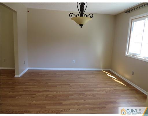 36 Gable Court Old Bridge, NJ 07747 - Photo 4 of 22 a view of room with hardwood floor and window