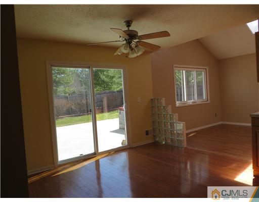 36 Gable Court Old Bridge, NJ 07747 - Photo 6 of 22 a view of empty room with wooden floor and fan