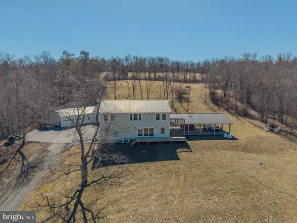 a view of a swimming pool and trees in the background