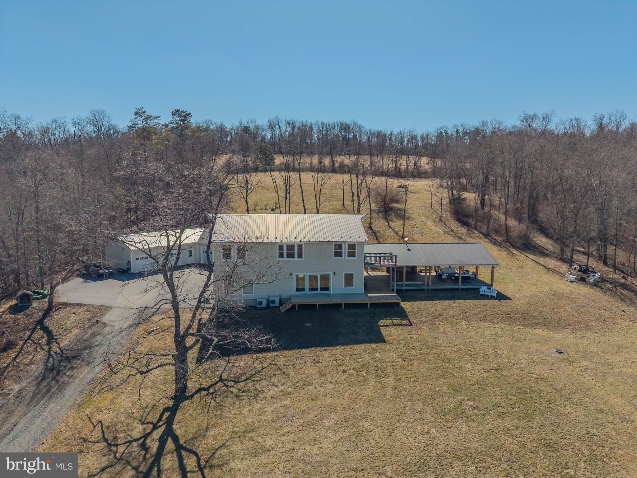 a view of a swimming pool and trees in the background