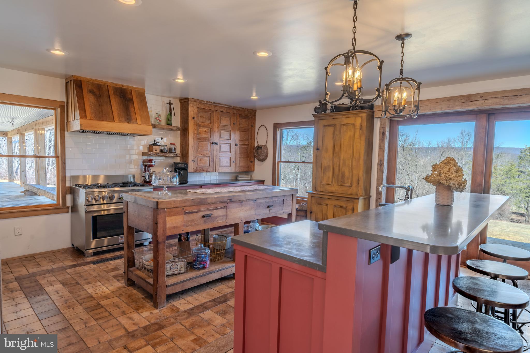 651 Robinson Road Newport, PA 17074 - Photo 22 of 87 a kitchen with stainless steel appliances granite countertop a stove a refrigerator a sink dishwasher with a dining table and chairs