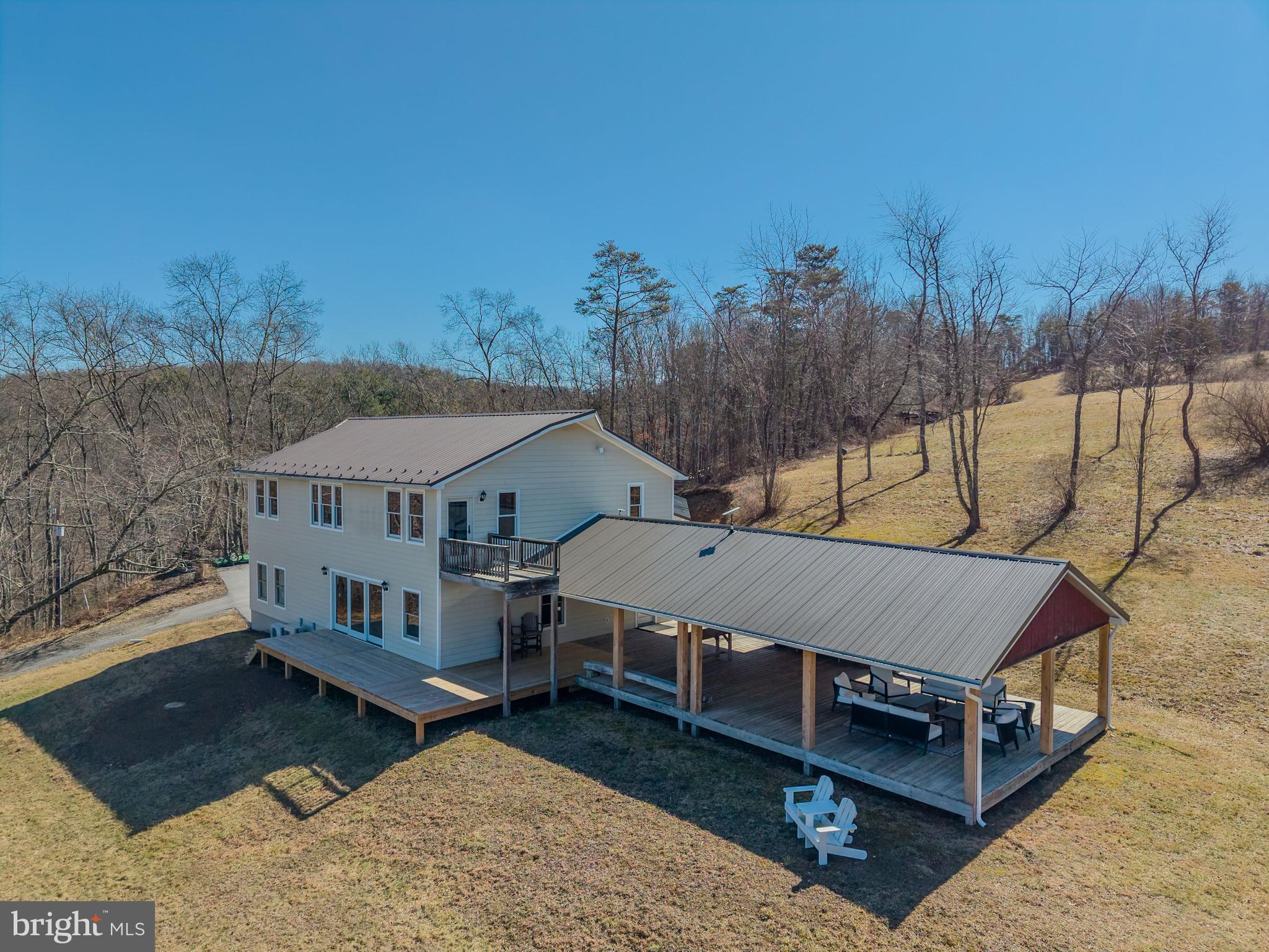 651 Robinson Road Newport, PA 17074 - Photo 3 of 87 a view of a house with a yard and roof