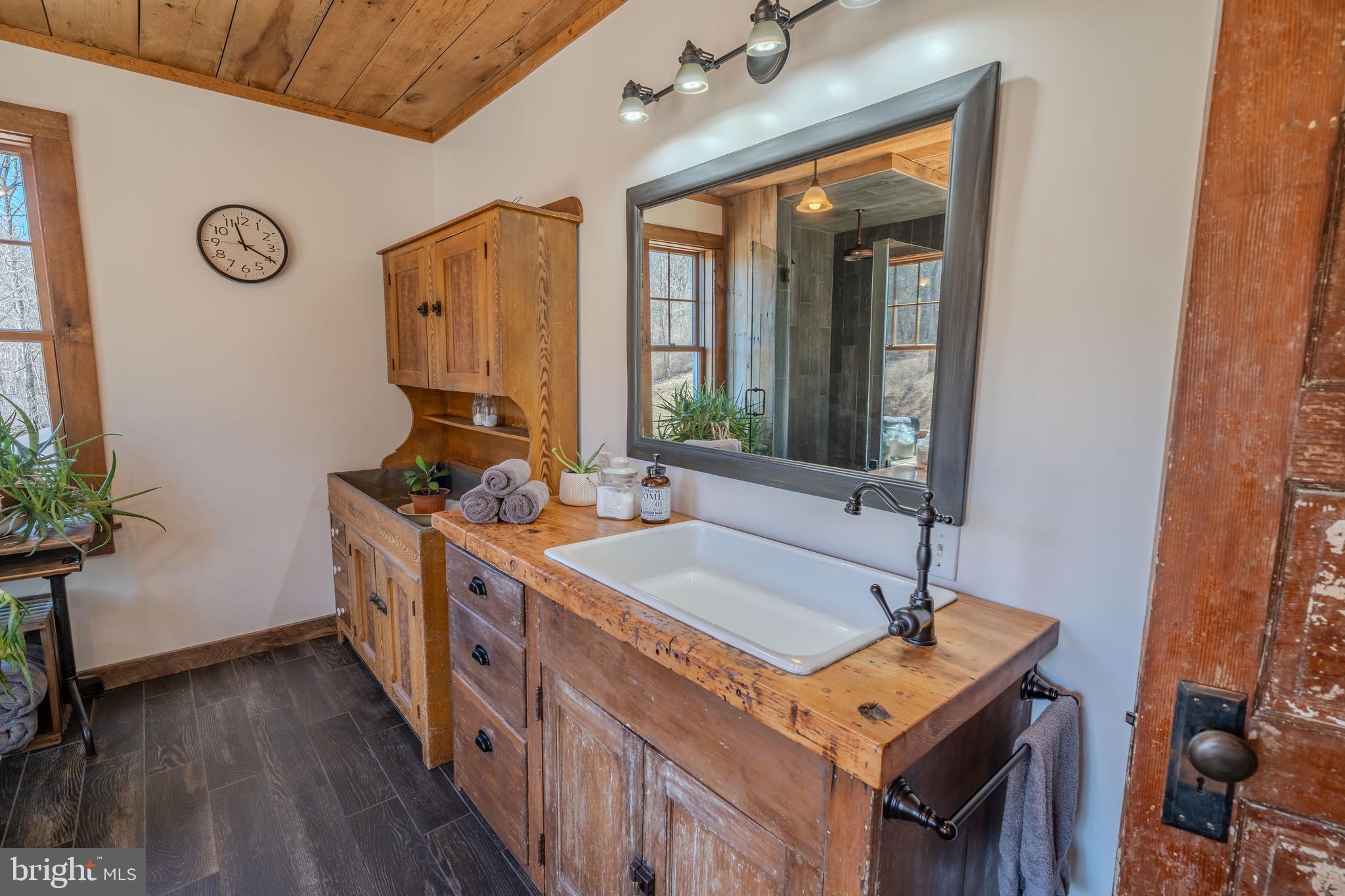 651 Robinson Road Newport, PA 17074 - Photo 34 of 87 a spacious bathroom with a double vanity sink and a mirror