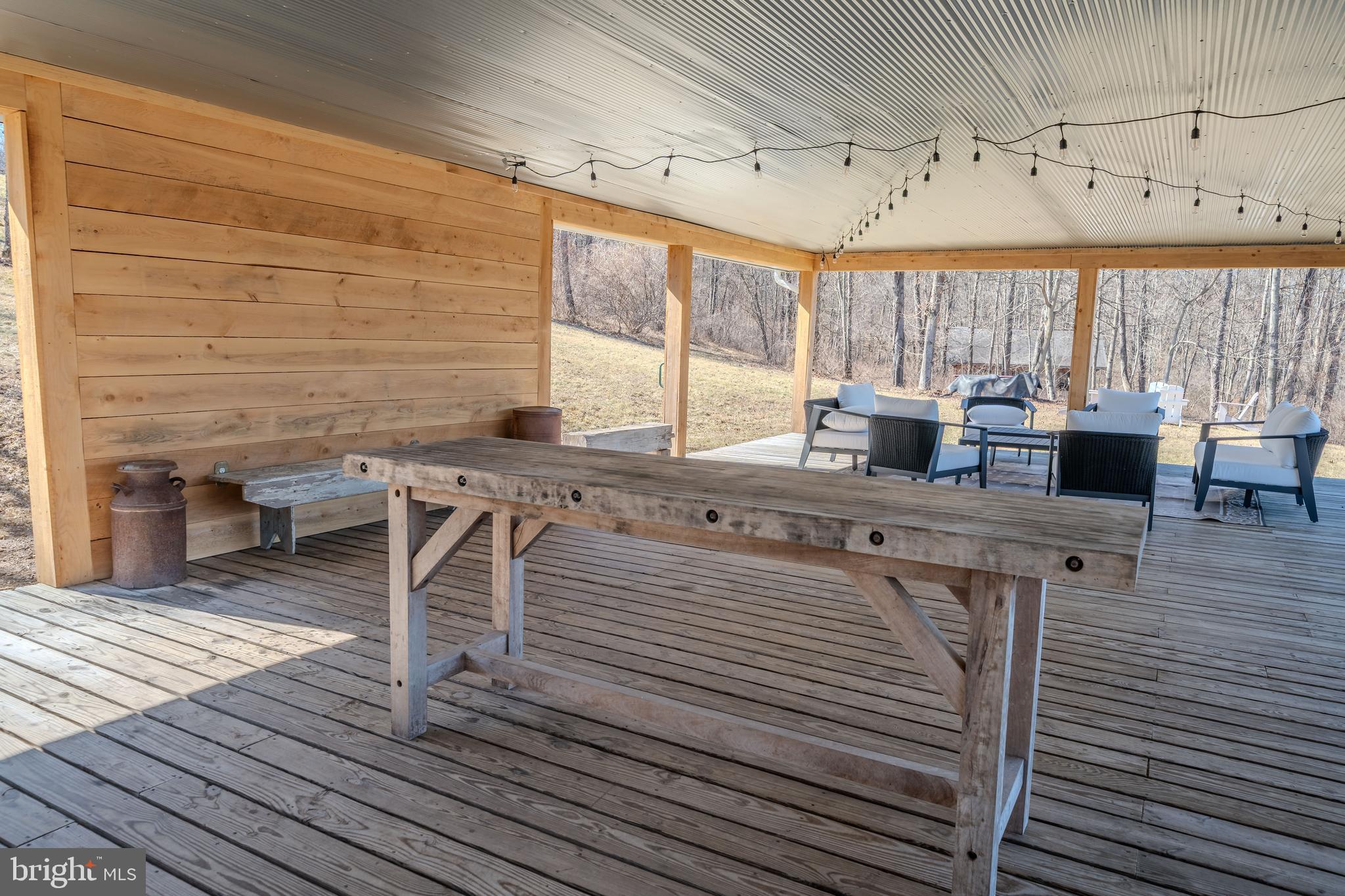 651 Robinson Road Newport, PA 17074 - Photo 52 of 87 a kitchen with stainless steel appliances kitchen island granite countertop a table chairs and a wooden floor
