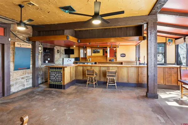 a view of a tables and chairs in a room