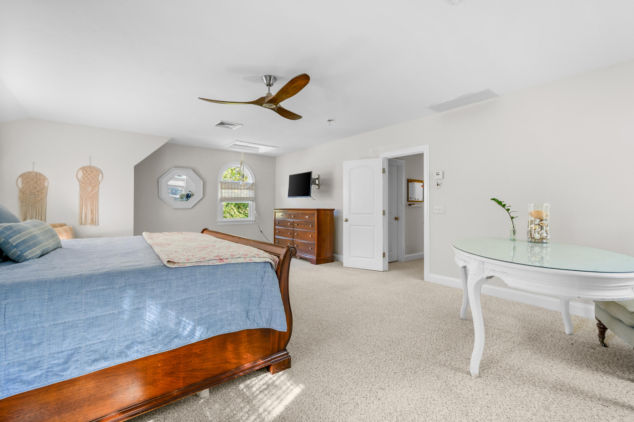 250 The Plains Road West Barnstable, MA 02668 - Photo 16 of 44 a bedroom with a bed and ceiling fan