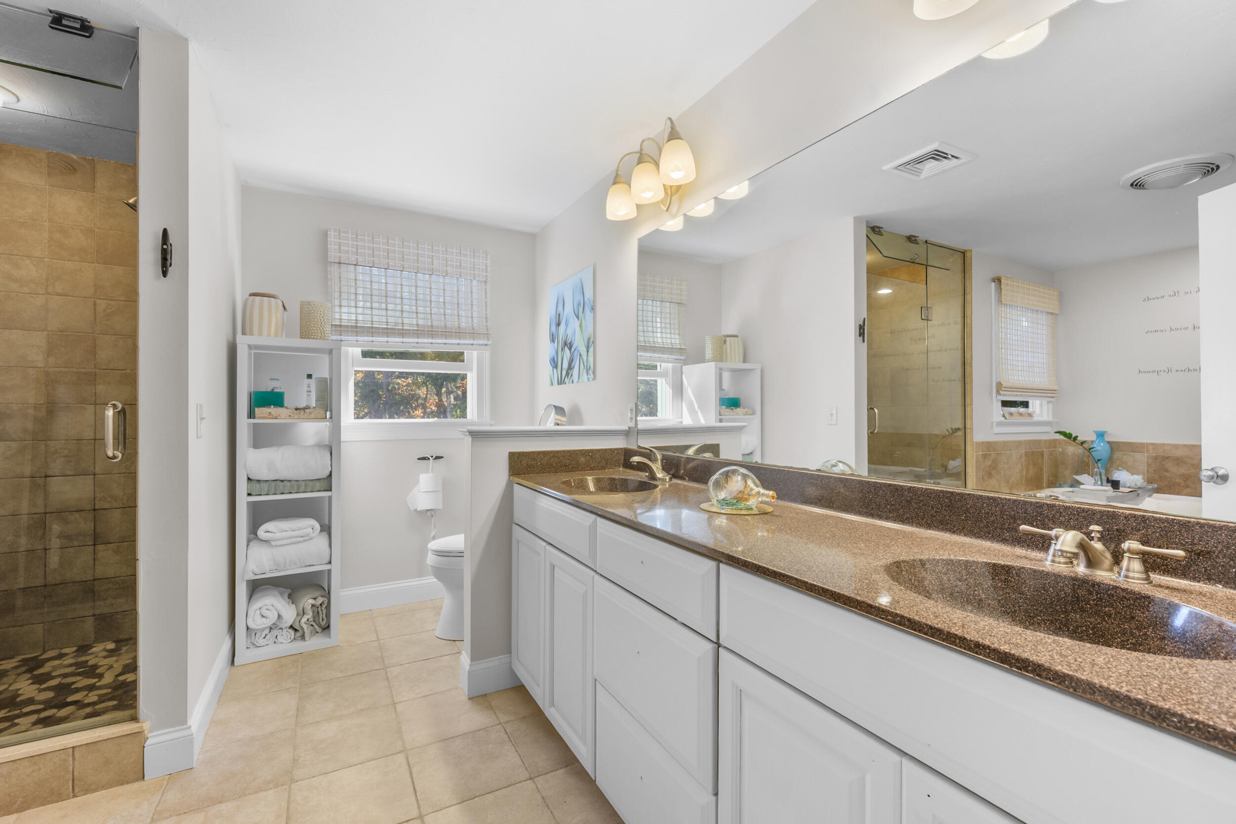 250 The Plains Road West Barnstable, MA 02668 - Photo 17 of 44 a spacious bathroom with a granite countertop sink a mirror and a shower