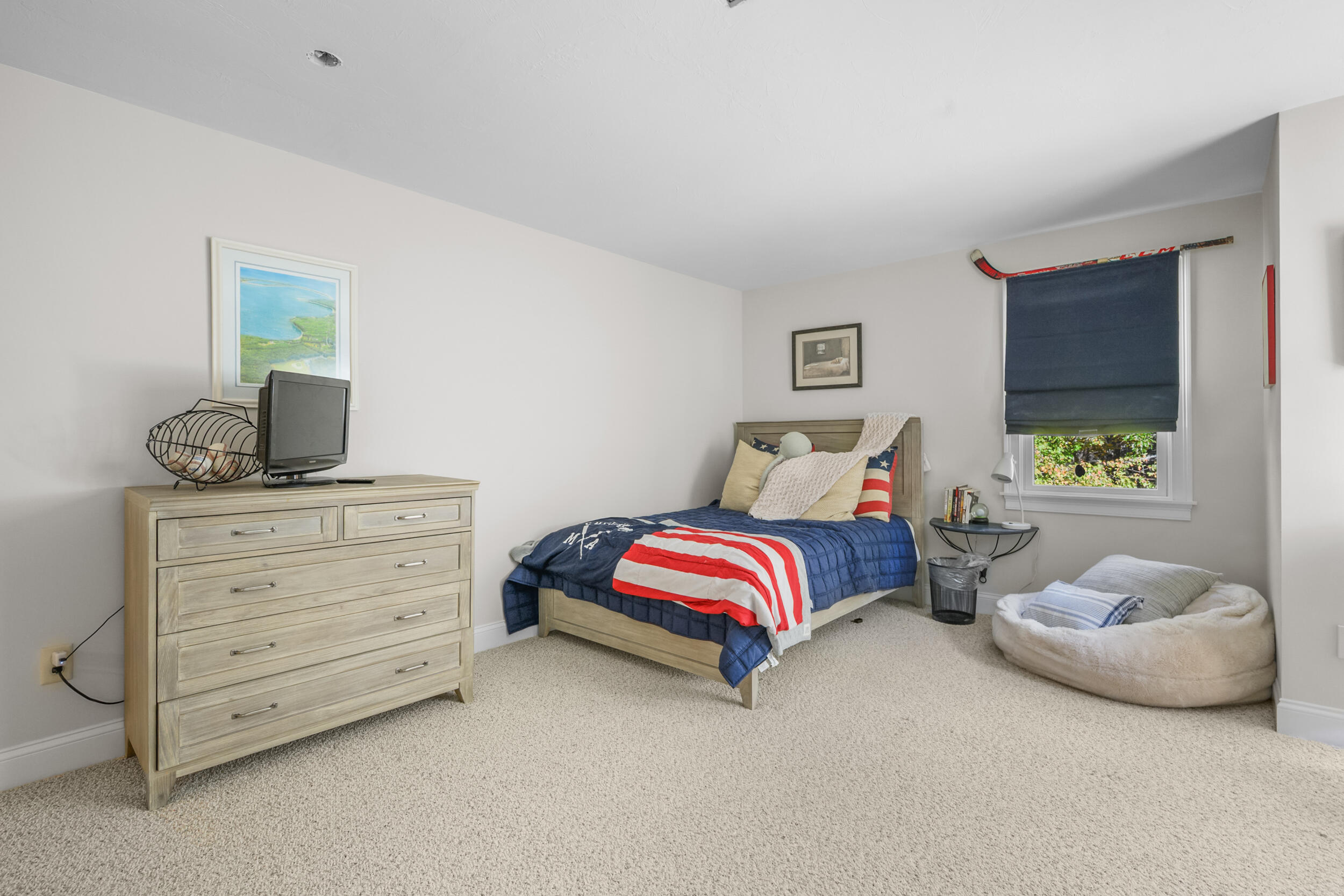 250 The Plains Road West Barnstable, MA 02668 - Photo 20 of 44 a bedroom with a bed and a couch