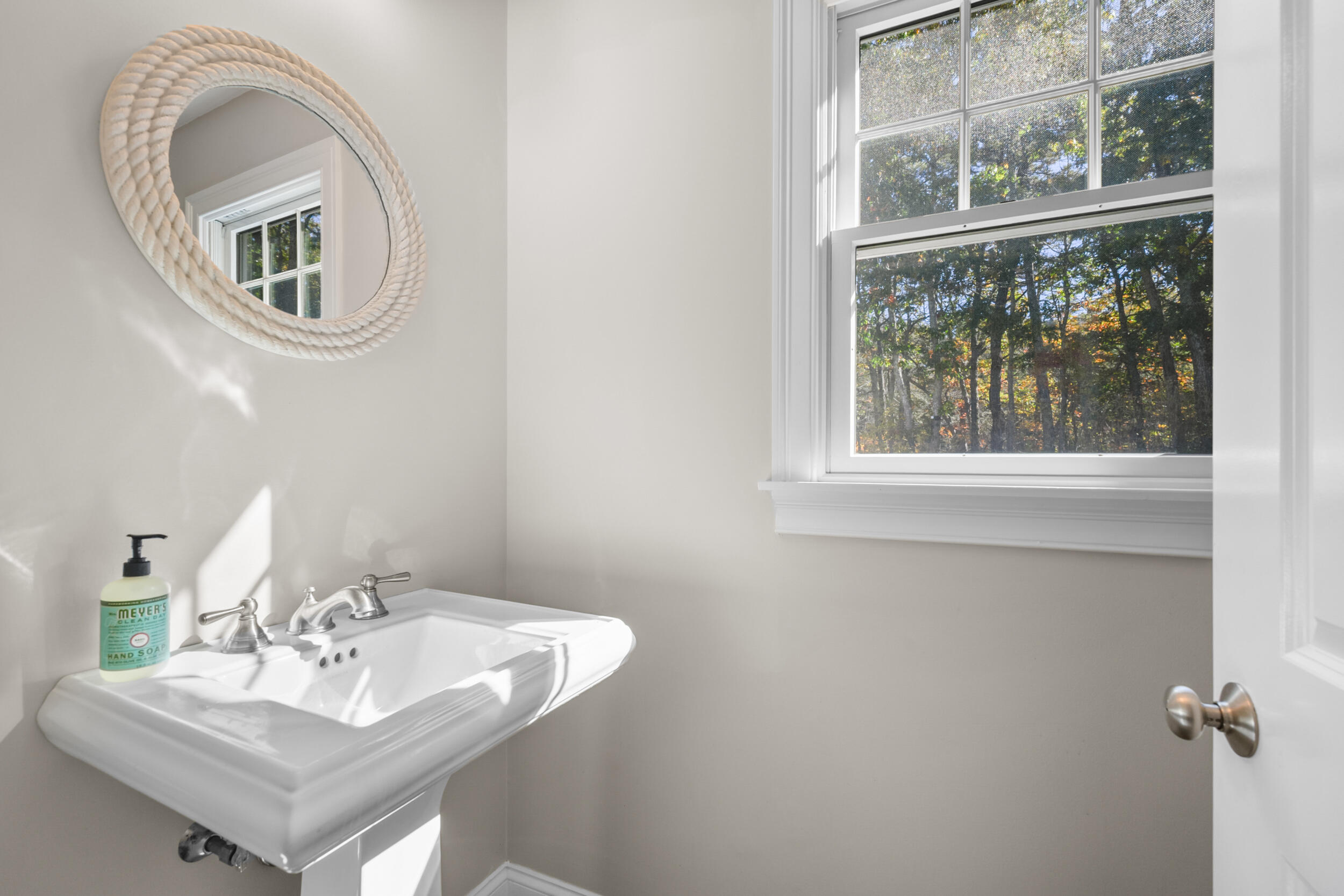 250 The Plains Road West Barnstable, MA 02668 - Photo 29 of 44 a bathroom with a sink and a mirror
