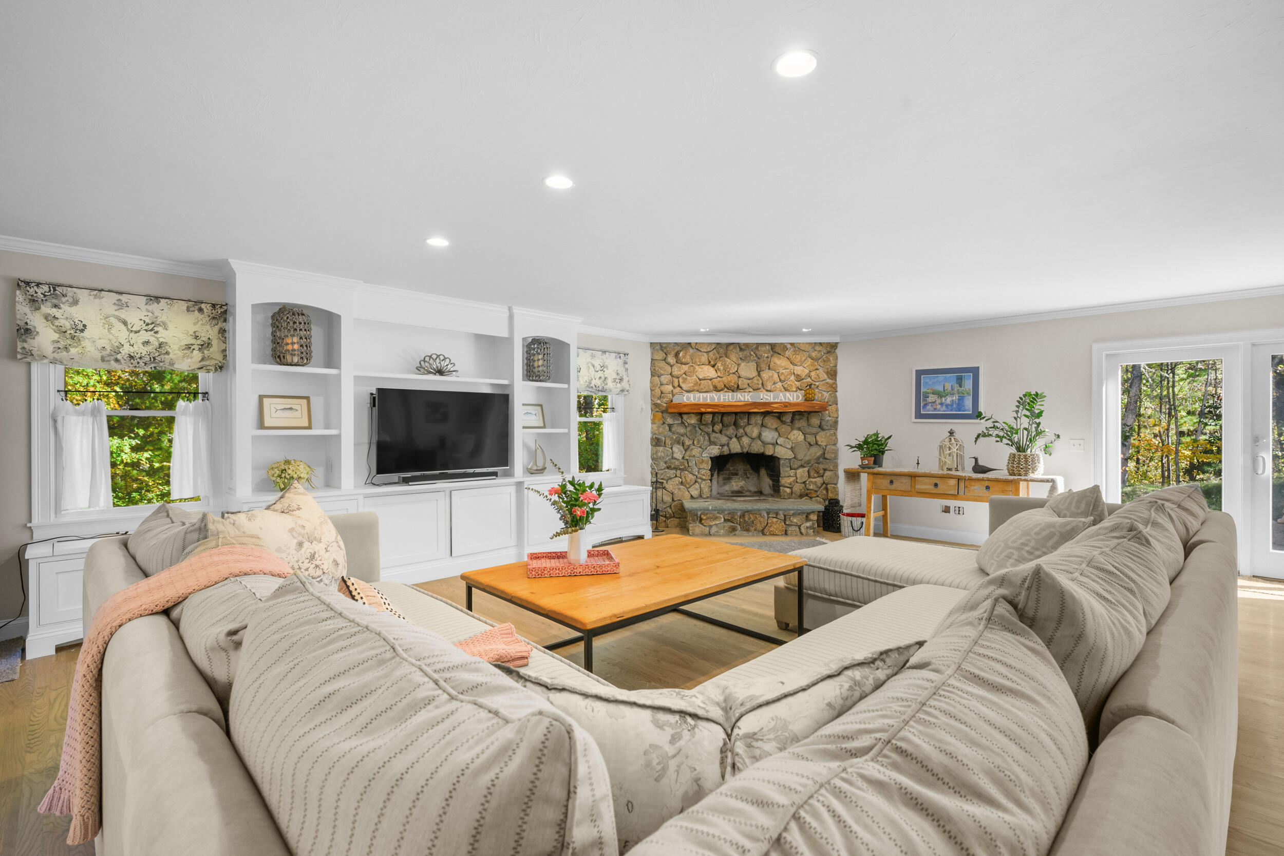 250 The Plains Road West Barnstable, MA 02668 - Photo 3 of 44 a living room with furniture a flat screen tv and a fireplace