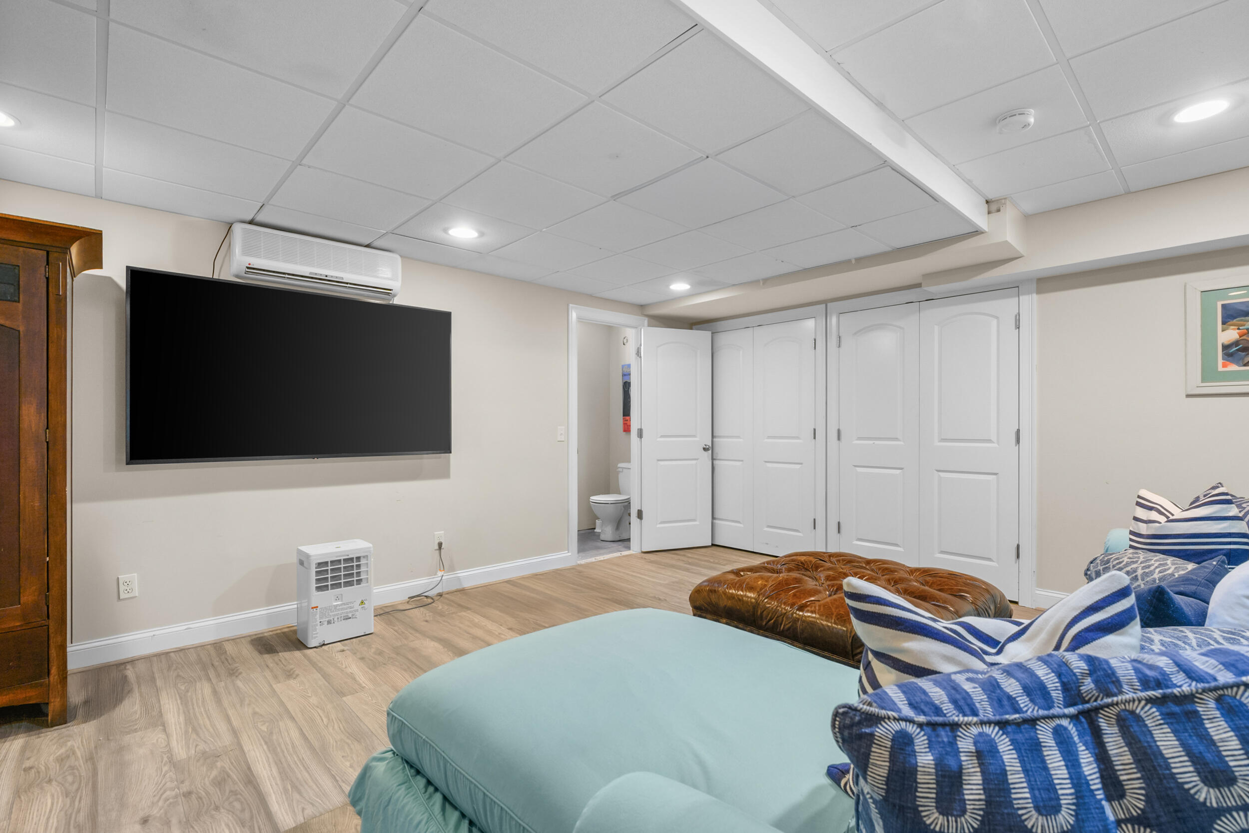 250 The Plains Road West Barnstable, MA 02668 - Photo 32 of 44 a bedroom with a bed and a flat screen tv