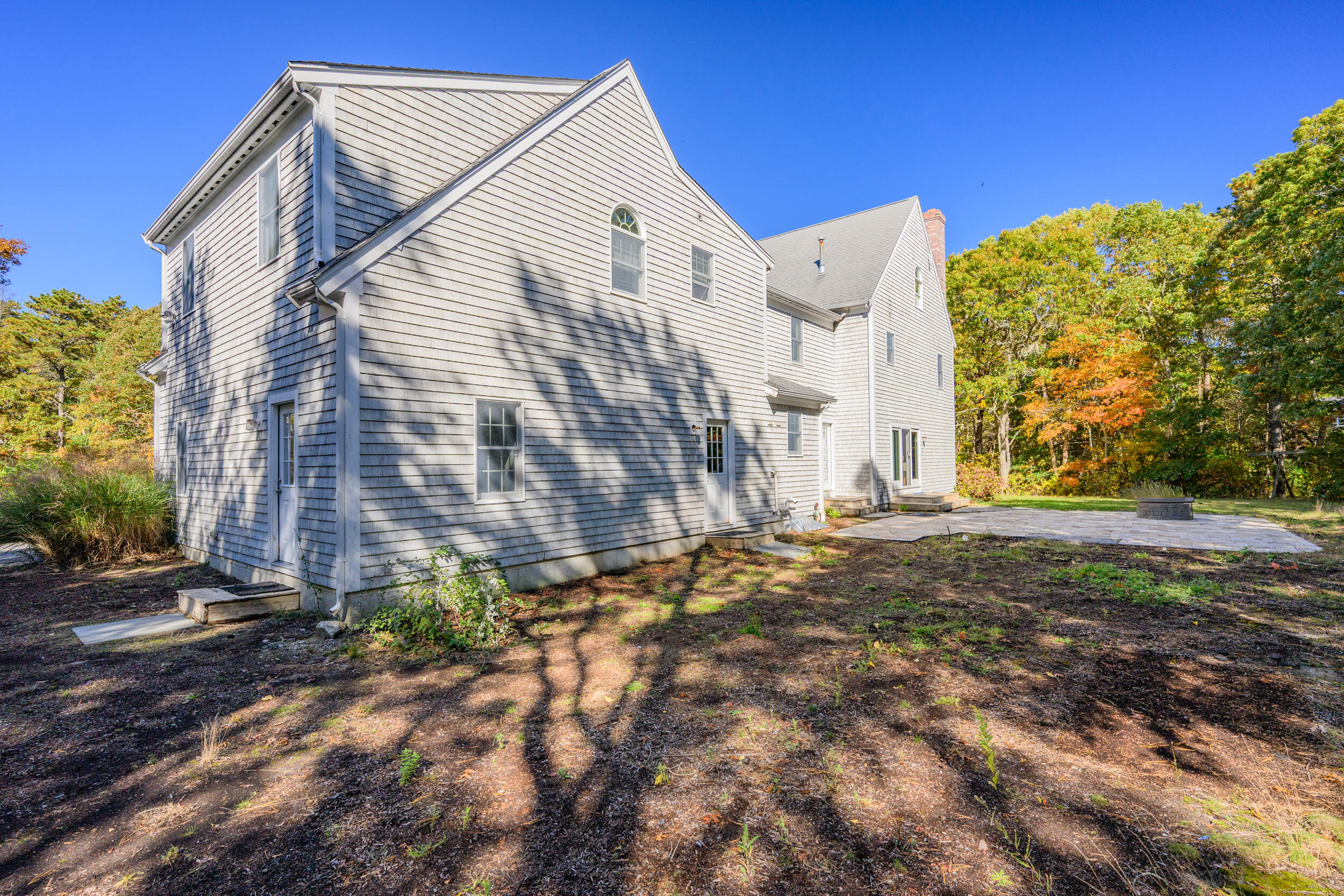 250 The Plains Road West Barnstable, MA 02668 - Photo 37 of 44 a view of a house with a yard and sitting area