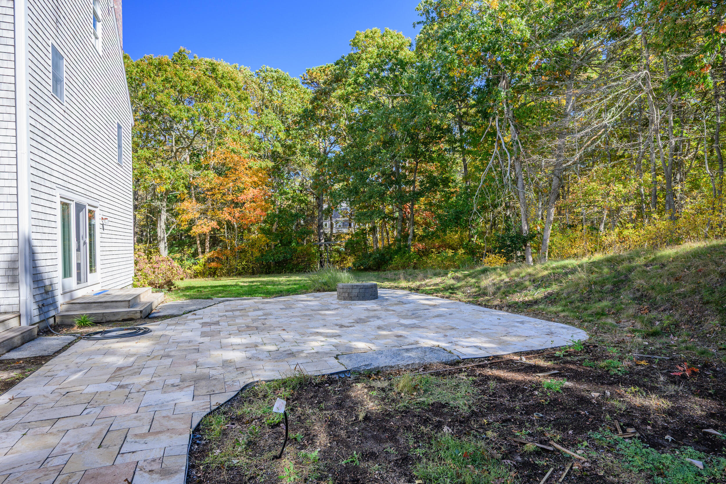 250 The Plains Road West Barnstable, MA 02668 - Photo 39 of 44 a view of a backyard with plants and large trees