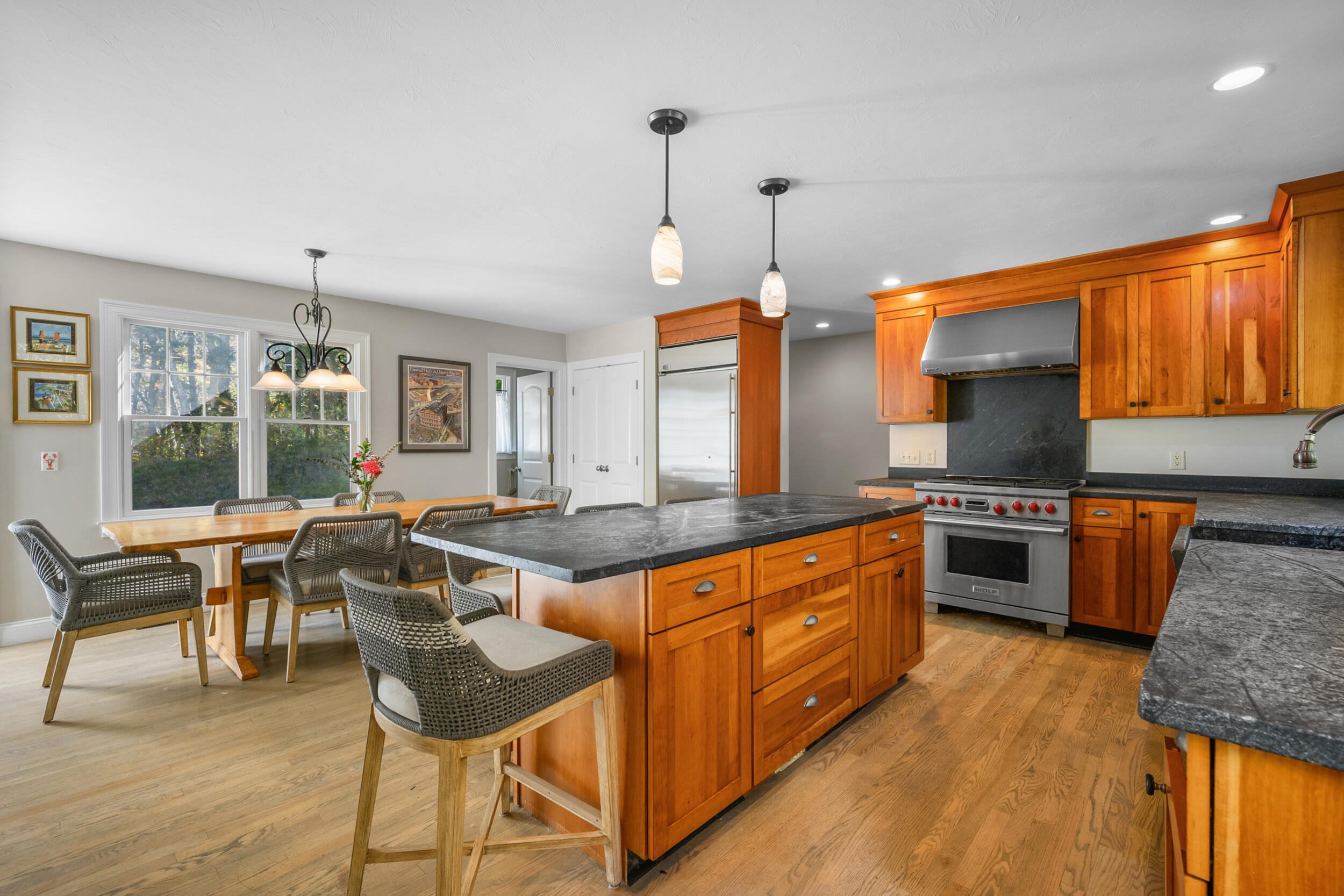 250 The Plains Road West Barnstable, MA 02668 - Photo 9 of 44 a kitchen with stainless steel appliances granite countertop a stove a sink and a refrigerator