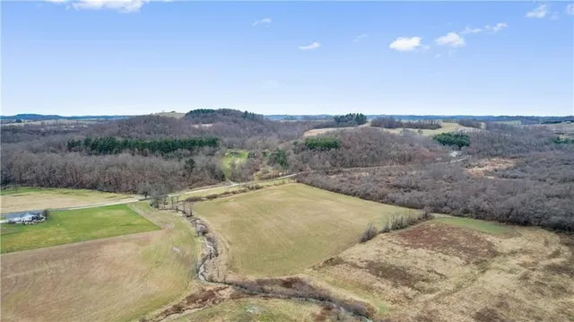 a view of a backyard with a swimming pool and mountains