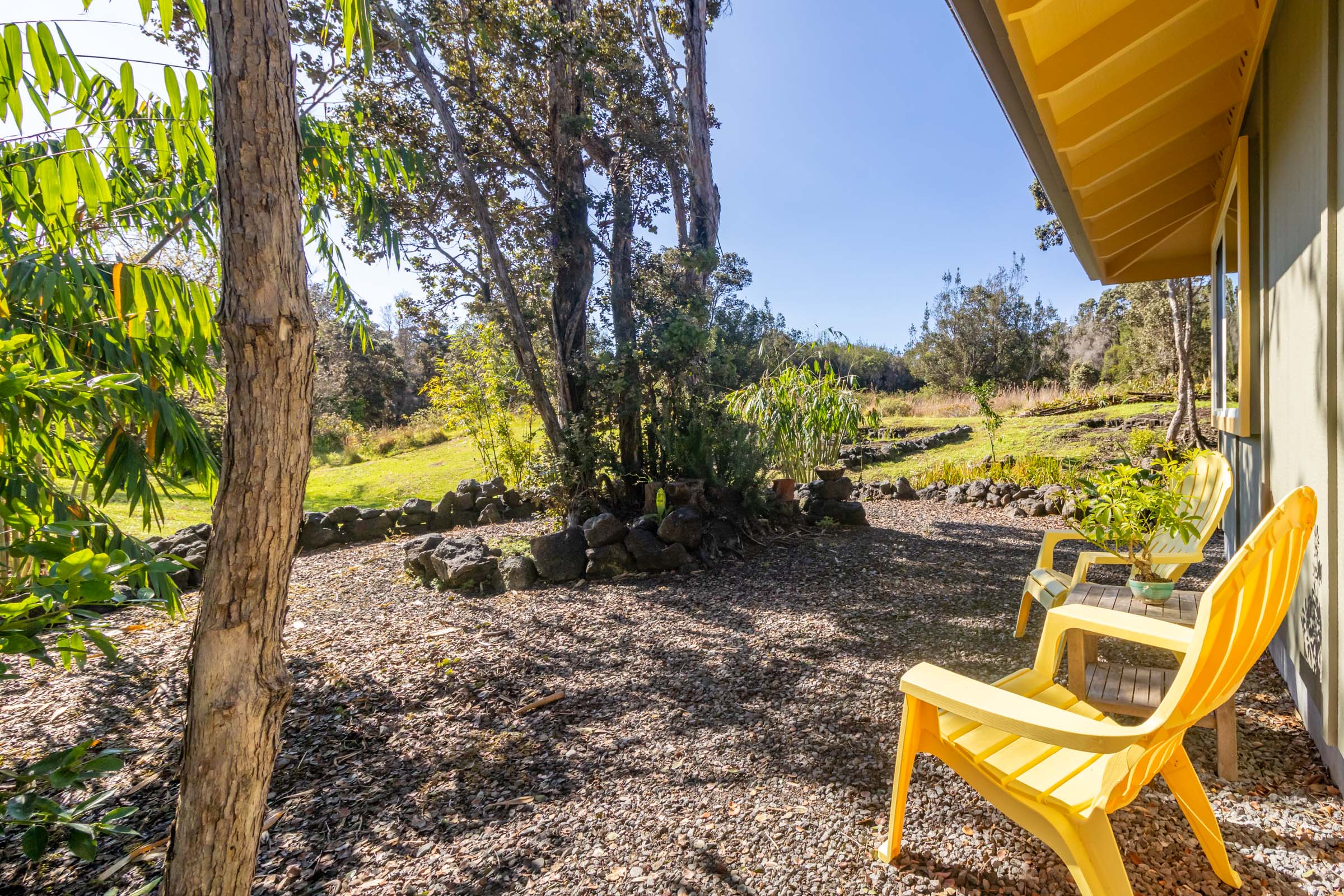 99-1845 Pukeawe Circle Volcano, HI 96785 - Photo 20 of 26 a view of a chair and table in the garden