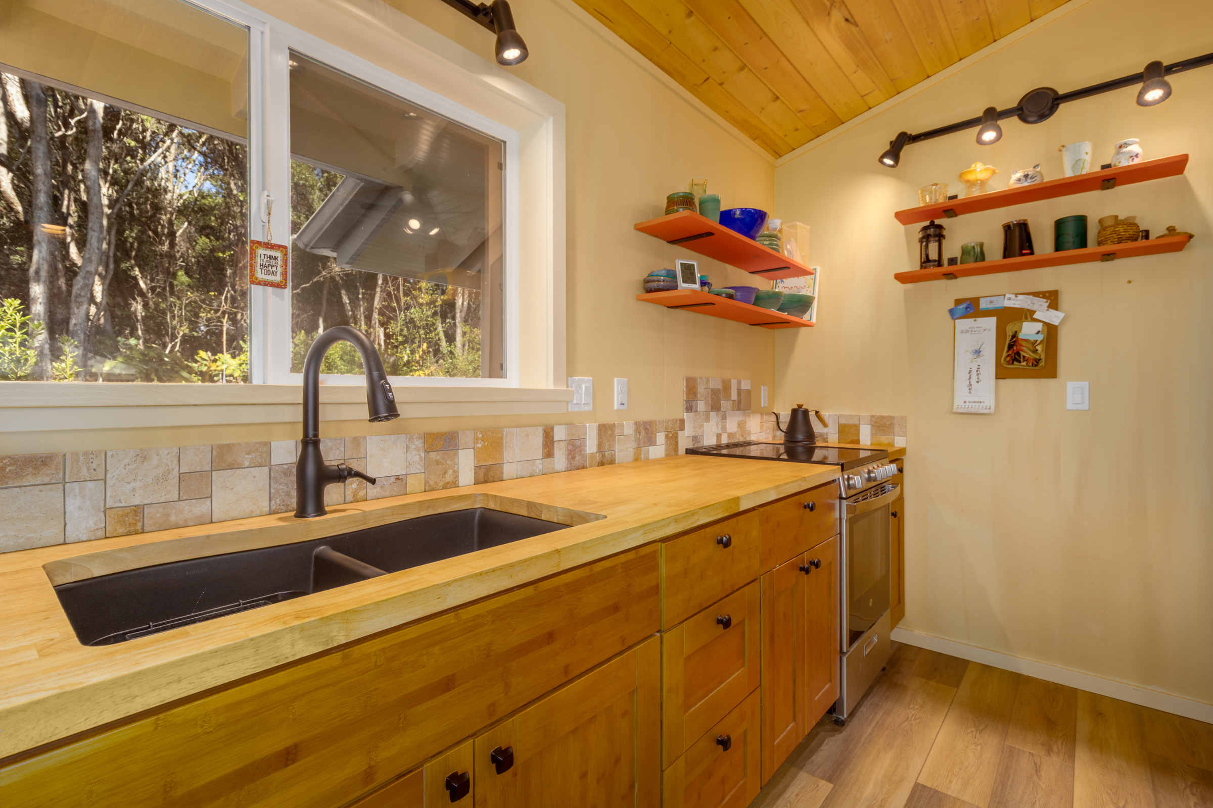 99-1845 Pukeawe Circle Volcano, HI 96785 - Photo 6 of 26 a kitchen with a sink and wooden floor