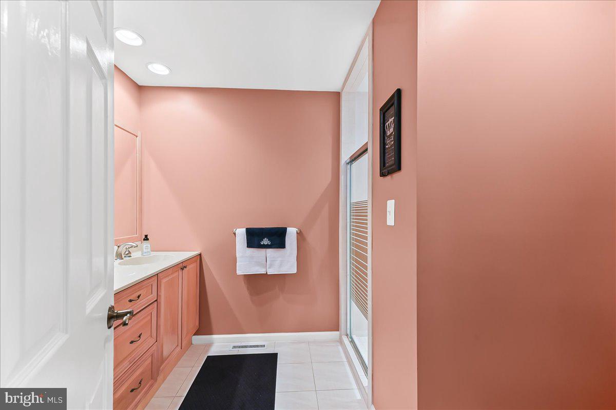 780 Tannery Drive Wayne, PA 19087 - Photo 30 of 59 a bathroom with a sink and a mirror