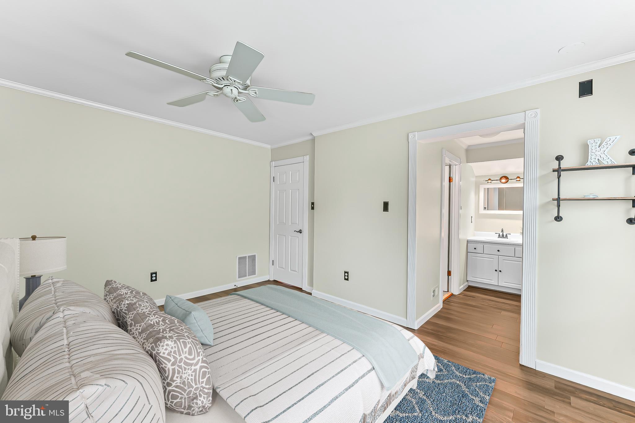 780 Tannery Drive Wayne, PA 19087 - Photo 46 of 59 a bedroom with a bed and a chandelier